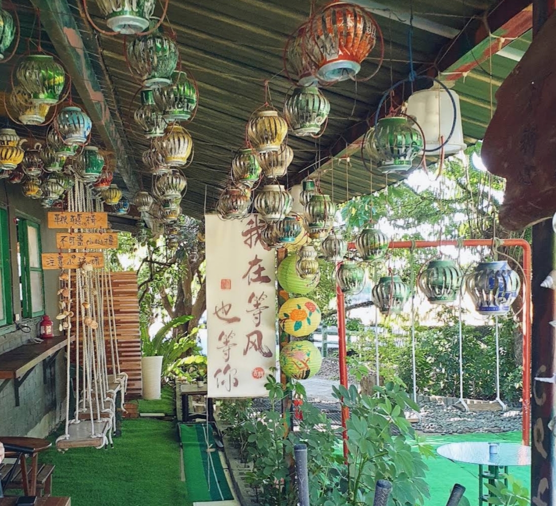 Colorful lanterns on Kamon Café's garden terrace